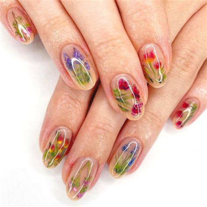 Botanical pressed flower nail art with dried florals embedded in gel