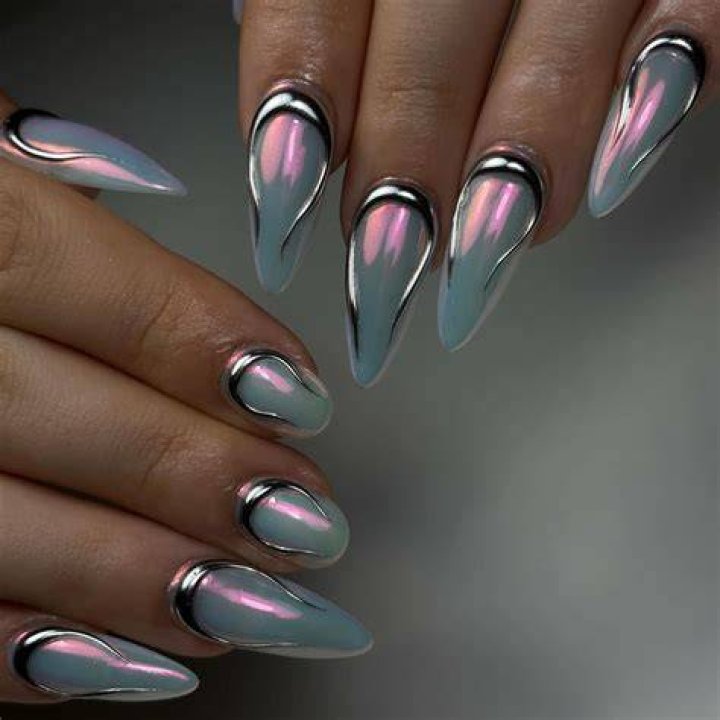 Futuristic metallic mirror and foil nail art designs for 2026